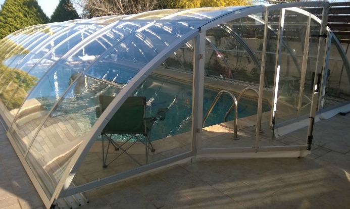 A polycarbonate - swimming pool enclosure cost about $2999