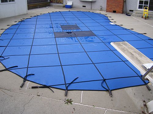 A blue mesh pool cover