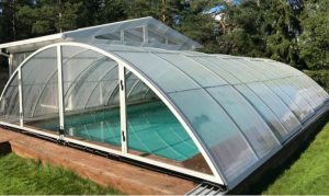 Pool enclosure with solid polycarbonate sheet